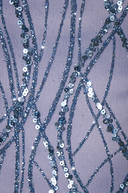 Women's blue glitter mini dress with blue feather trim, square neckline and bodycon fit. Model is 5ft2' and wears a size XS 6.