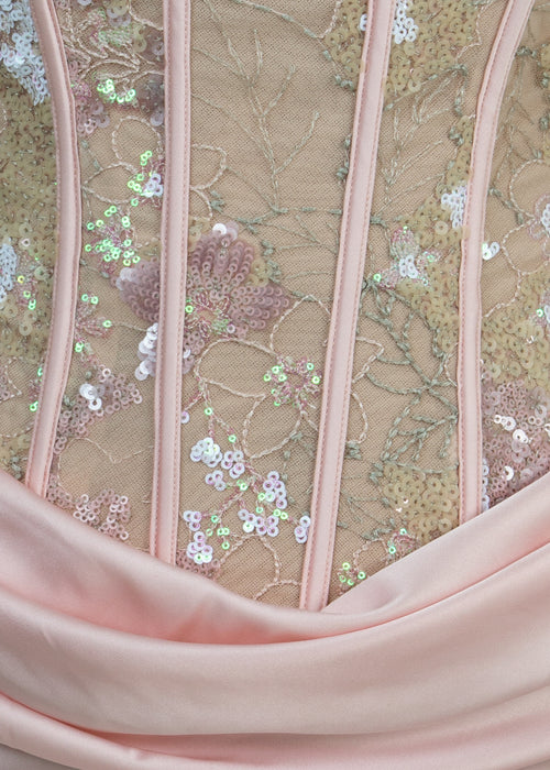 Women's corset pink prom gown with embellished corset and satin skirt with thigh slit. Strapless design and figure hugging fit.