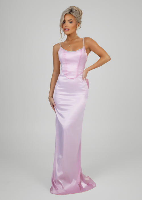 Women's pink elegant ball gown dress features a low plunge back with a sparkling diamante trim, a statement bow detail, and a flattering fishtail silhouette. Made from pink soft stretch satin fabric that hugs your curves for a glamourous look.