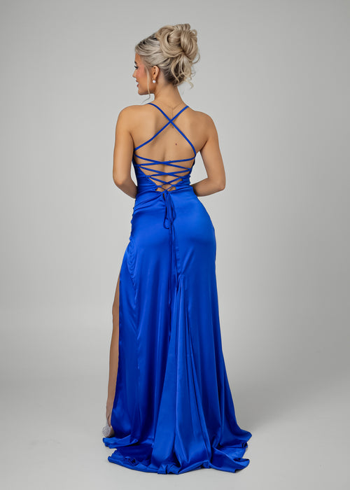 Women's cobalt blue satin gown with thigh high slit, spaghetti straps and a figure hugging fit.