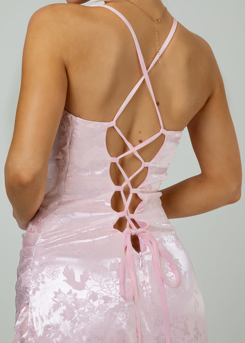 Women's Jacquard pink satin maxi dress with a side split and lace up black detail. 