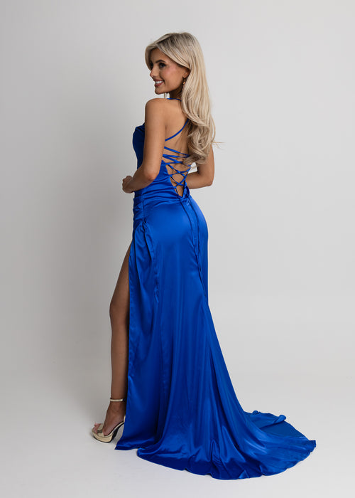 Women's cobalt blue satin gown with thigh high slit, spaghetti straps and a figure hugging fit.