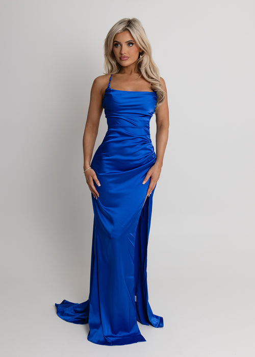 Women's cobalt blue satin gown with thigh high slit, spaghetti straps and a figure hugging fit.