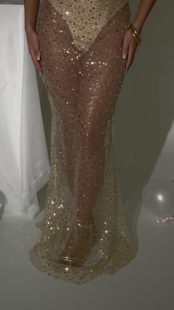 Women's gold sequin and beaded maxi dress with built in bodysuit and sheer maxi skirt fully embellished. Figure hugging fit, strapless style and built in cups. Model is 5ft2' and wears a size XS 6.