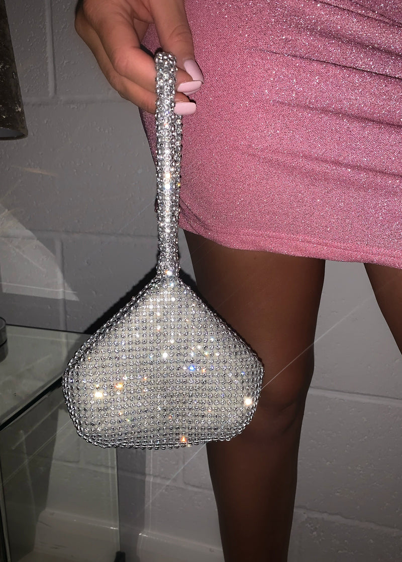 silver sparkly jewel bag with a zip and popper closing. 
